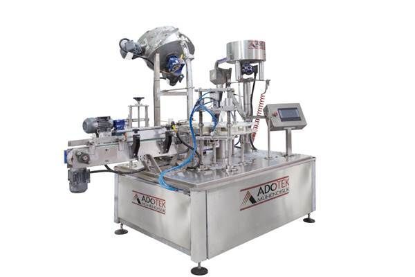 ADK 323 ECO Rotary İndeksli Dolum Kapak Etiket ve Tepsi Makinası(Akışkan Ürün)